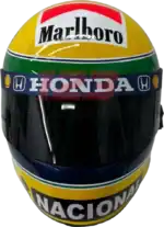 Full-scale replica of Ayrton Senna’s 1992 Formula 1 helmet, detailed collector’s display model.