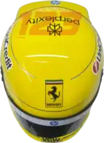 Full-scale replica of Lewis Hamilton’s 2025 Ferrari Monza Grand Prix helmet, detailed collector’s display model.