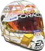 Full-scale replica of Max Verstappen’s “4 Titles” 2024 championship helmet, detailed collector’s display model.