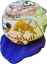 Full-scale replica of Max Verstappen’s “4 Titles” 2024 championship helmet, detailed collector’s display model.