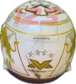 Full-scale replica of Max Verstappen’s “4 Titles” 2024 championship helmet, detailed collector’s display model.