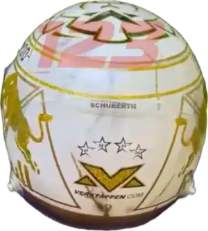 Full-scale replica of Max Verstappen’s “4 Titles” 2024 championship helmet, detailed collector’s display model.