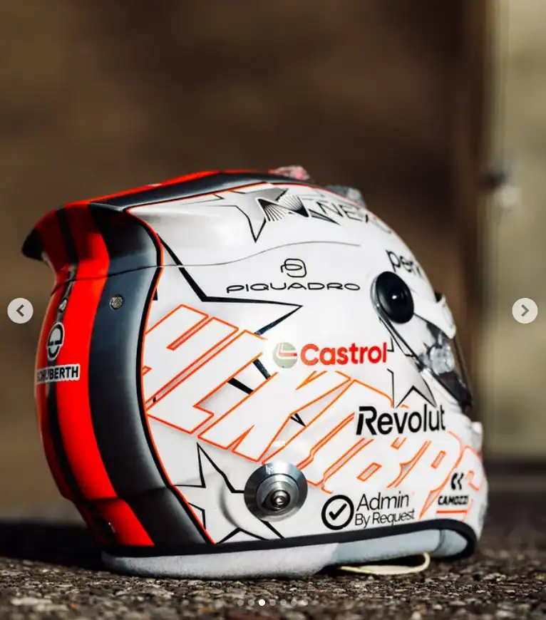 Synthetic racing helmet with sponsor logos, designed for professional motorcycle racing.