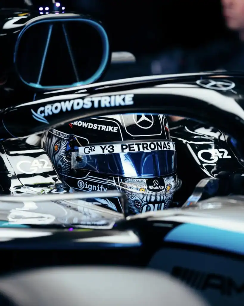 Kimi Antonelli wearing the Y-3 wolf helmet design in the Mercedes W17 cockpit at Suzuka 2026, featuring Chikami Hayashi wolf artwork with amber eyes