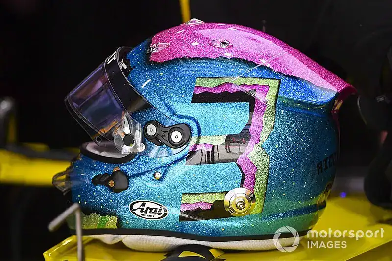 F1 driver helmet livery design variety, showcasing custom special-edition helmet artwork used across a season