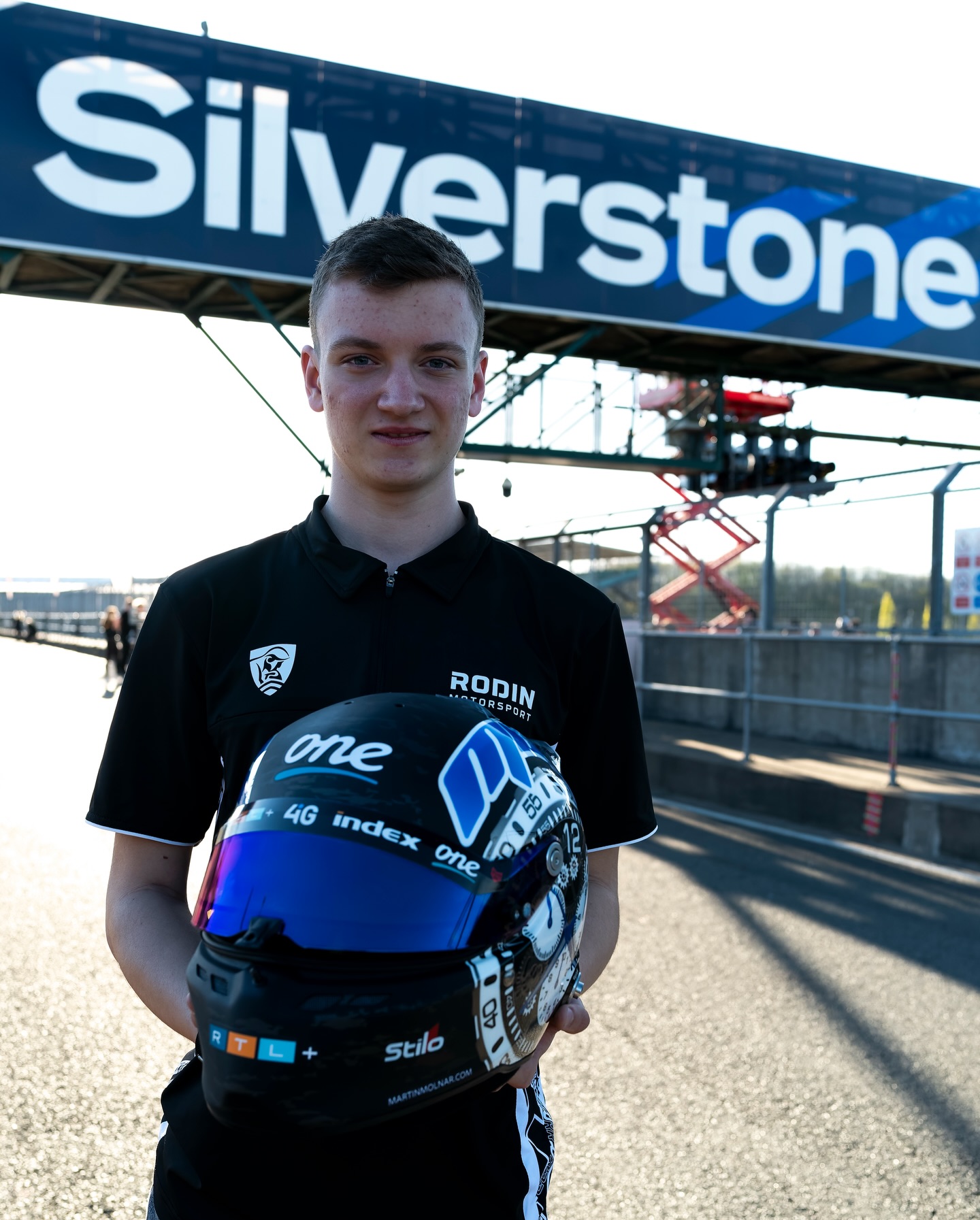 Photo shared by Stilo Official on May 01, 2026 tagging @valtteribottas, @stilo_usa, and @cadillacf1. May be an image of racing vehicles, helmet, portable cassette player and text.