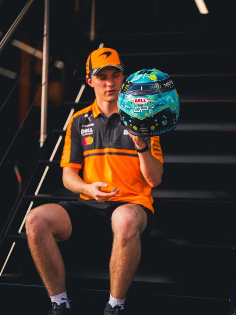 Detail of Oscar Piastri's 2026 Austrian GP helmet, crown and sponsor markings