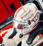Charles Leclerc's red and egg-white classic Monaco Grand Prix Ferrari helmet (2026) — display/collector reference image (worn)