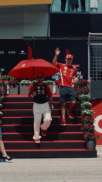 Video by Scuderia Ferrari HP on June 28, 2026. May be an image of standing, umbrella, street and text.