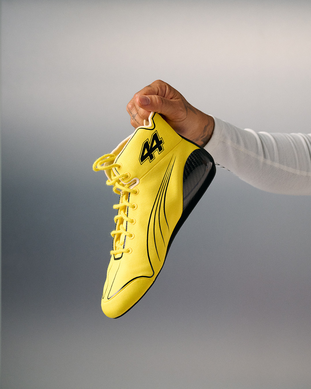 A yellow number 44 racing boot from Lewis Hamilton's special Silverstone look for the 2026 British Grand Prix.