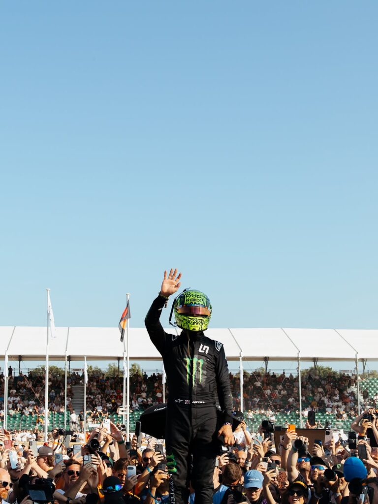 Photo by McLaren Mastercard Formula 1 Team 🧡 on July 10, 2026. May be an image of racing vehicles, helmet, crowd and text.