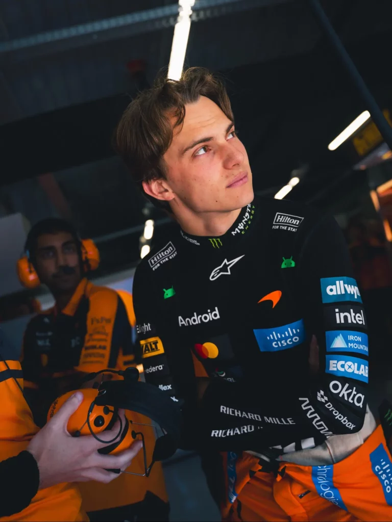 Photo by Oscar Piastri on July 26, 2026. May be an image of racing vehicles, race car, helmet and text that says 'Hilton FOMT STA MウNSブ Hilton FOR NE ht Android ALT edera allwp intel ١٠٠٠٠٠٠٠ CISCO ጠን lex IRON MOUKTAI ECXLAR okta RICHARO MIL MILLE RICHAROMILLE RICHARD vAMA vArm 茶 Dropbox Dropbox CISCO hraua'.