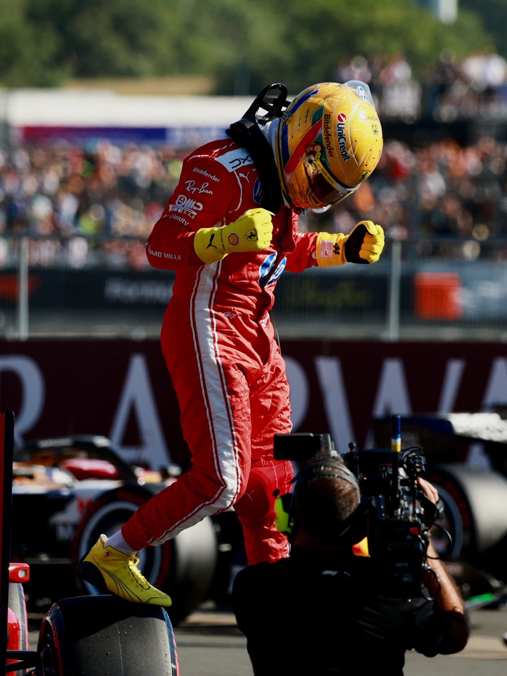 Lewis Hamilton leaps in celebration in parc ferme after taking sprint pole at the 2026 British Grand Prix, Silverstone