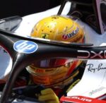 Lewis Hamilton's yellow 2026 Silverstone helmet seen through the Ferrari halo during British GP practice