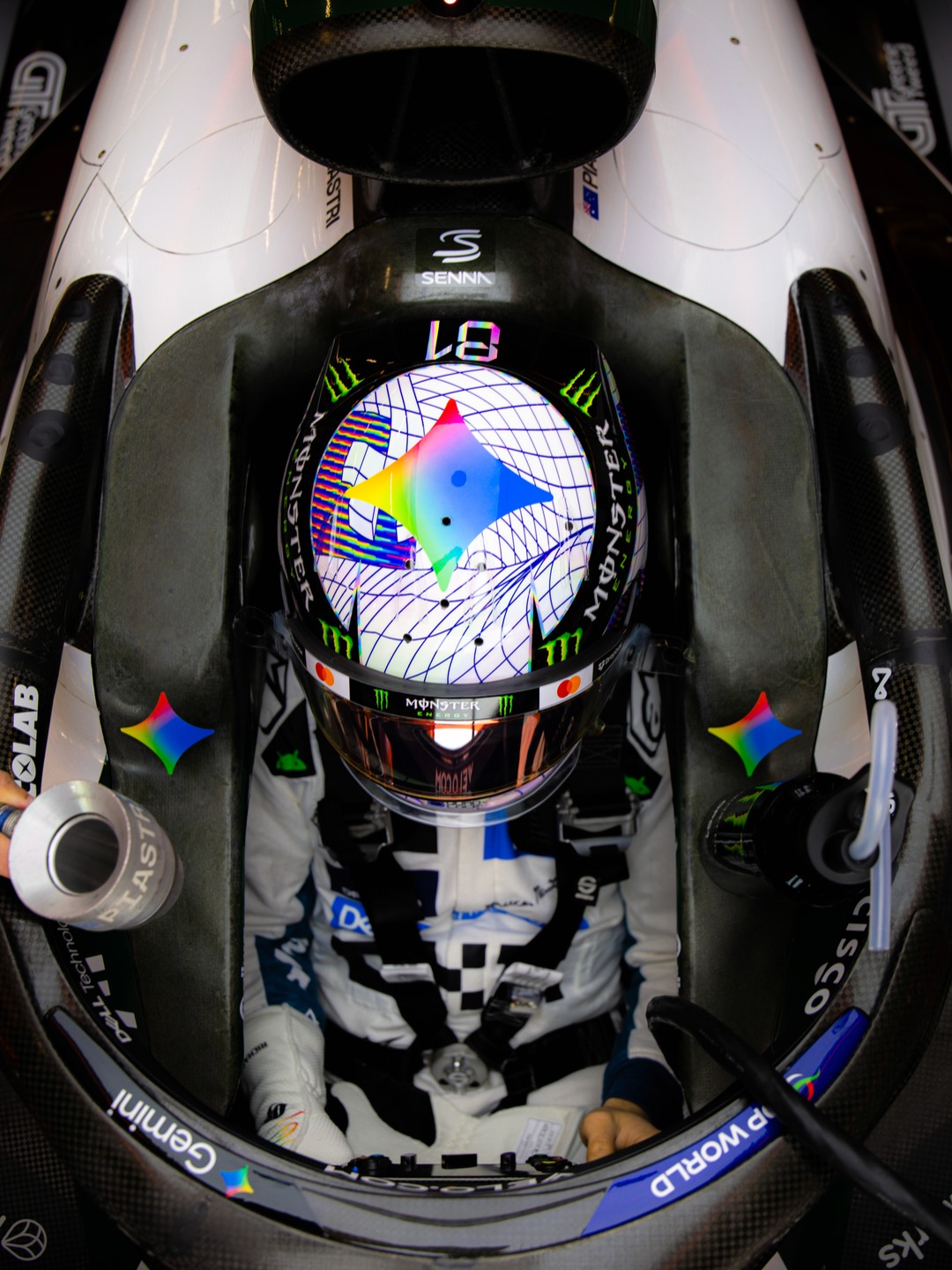 Oscar Piastri in the McLaren cockpit at Silverstone 2026 wearing the white grid helmet with an iridescent Gemini star