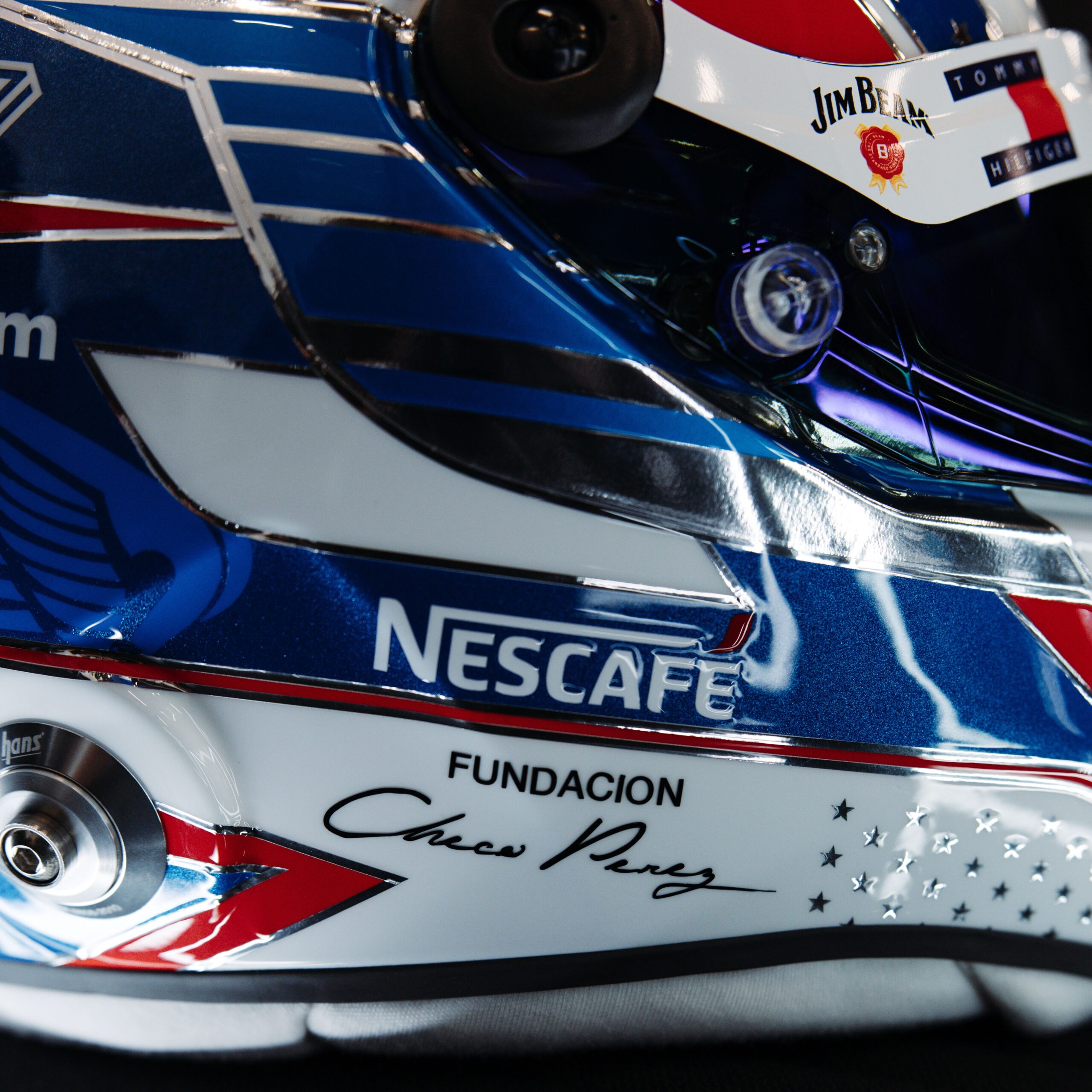 Fundacion Checo Perez signature on the chin bar of Sergio Perez's 2026 stars-and-stripes helmet