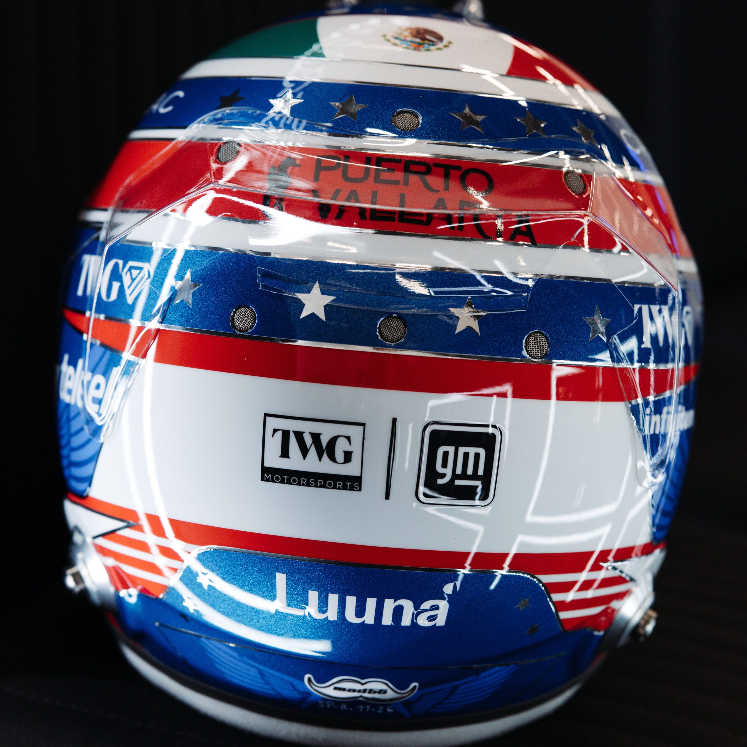 Rear of Sergio Perez's 2026 Silverstone helmet with the Mexican flag band and TWG Motorsports and GM logos