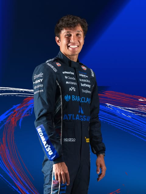 Alex Albon in the Williams special-edition 2026 British GP race suit — navy with Atlassian, Komatsu and Barclays marks