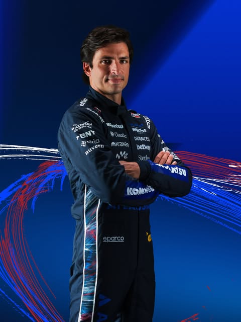 Carlos Sainz in the Williams special-edition 2026 British GP race suit — sponsor marks across the chest and arms