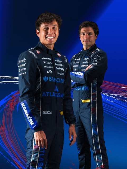 Williams F1 special-edition 2026 British GP race suits — Alex Albon and Carlos Sainz in navy suits with red-white-blue brushstroke detailing