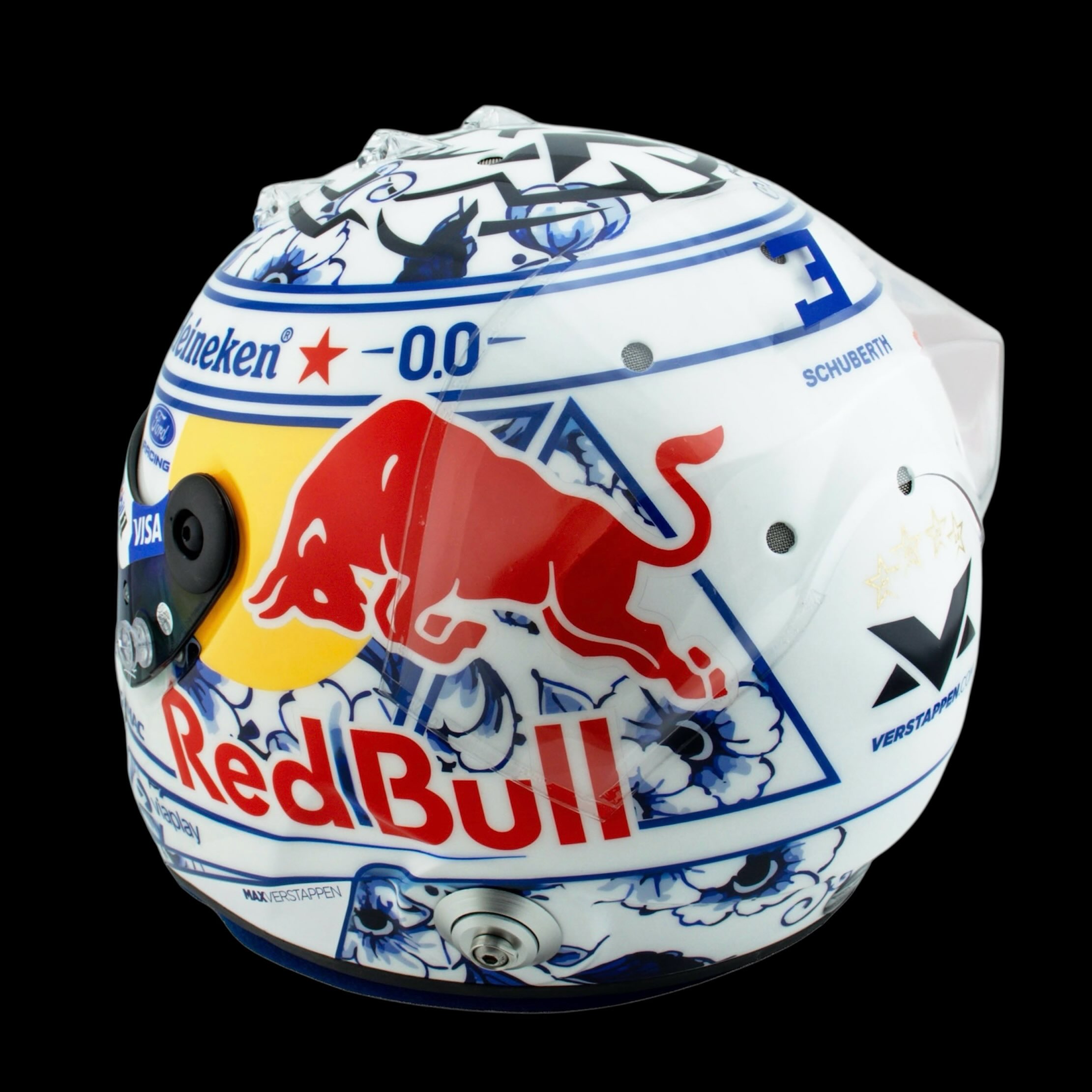 Left side of the helmet, the Red Bull wordmark set over painted Delft blue blooms on the white shell.