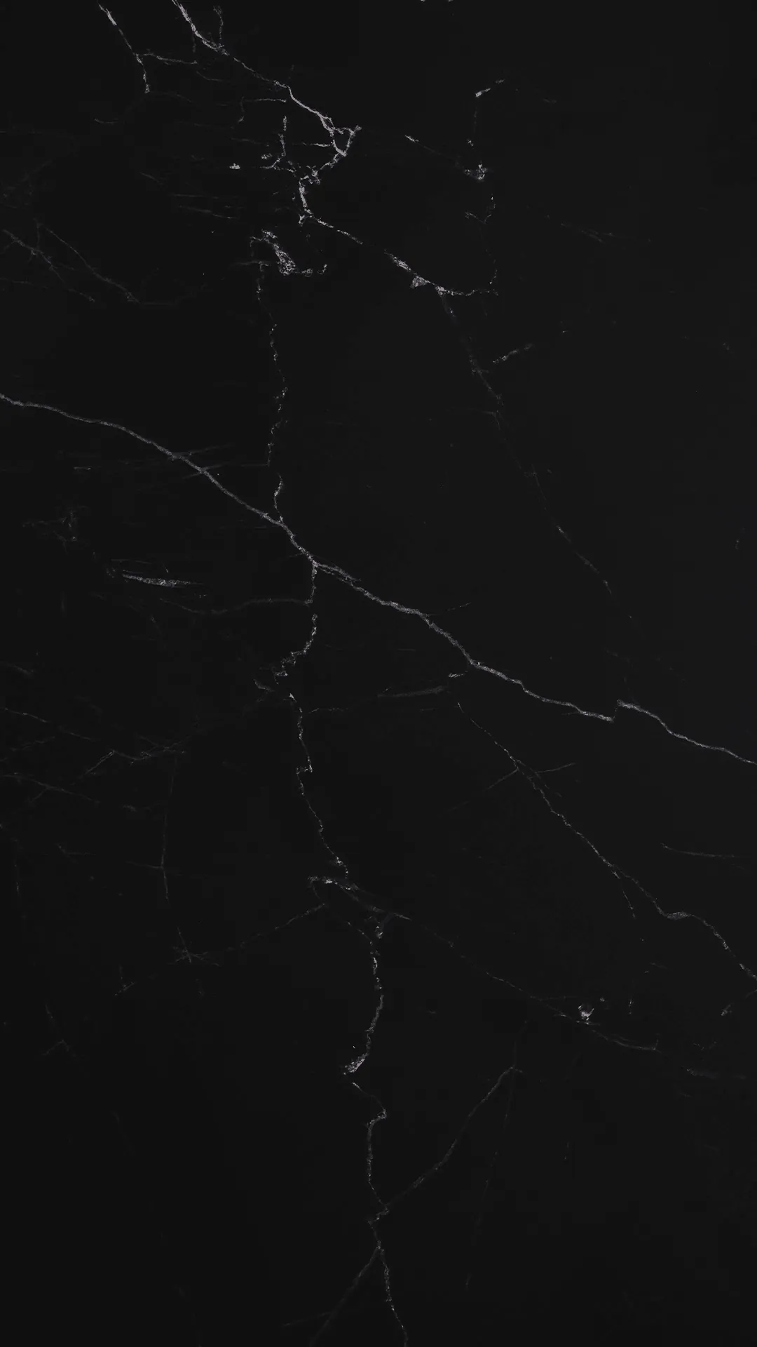Black marble surface with white veining, used as a decorative page background.