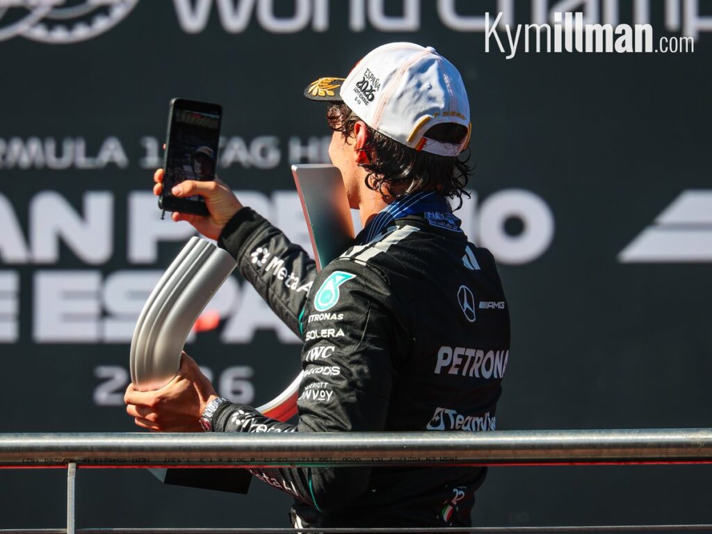 A BIT OF FUN After being doused in champagne, Kimi Antonelli took a moment to grab a selfie overlooking the Madring tra
