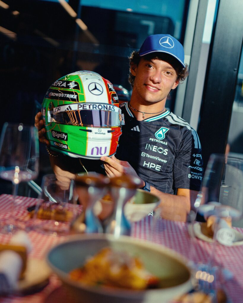 Andrea Kimi Antonelli holds his one-off Monza 2026 tricolore helmet, designed by Drudi Performance