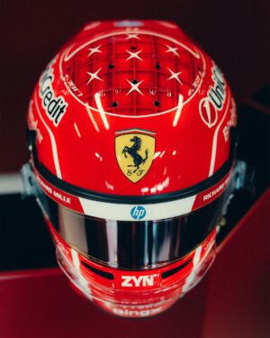 The seven crown stars and Ferrari shield on Leclerc's Monza 2026 helmet