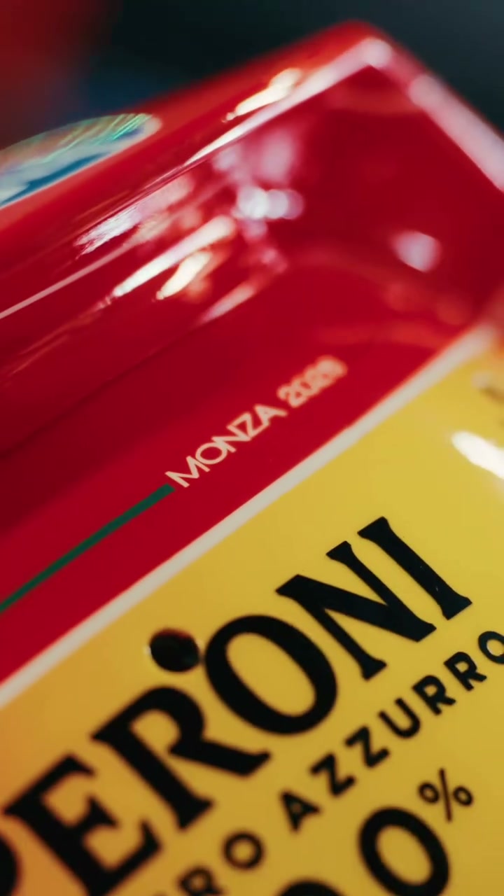 The MONZA 2026 lettering and the yellow Peroni panel on the rear of Leclerc's helmet