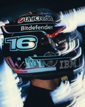 Full side view of Charles Leclerc's black 2026 Singapore GP helmet: blue number 16, Marina Bay skyline with the Singapore Flyer, UniCredit, Bitdefender and IBM