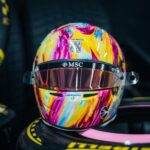 Front of Pierre Gasly's 2026 Mexico City GP helmet: brushstrokes in magenta, yellow and turquoise, Moser Watch crest, MSC visor strip