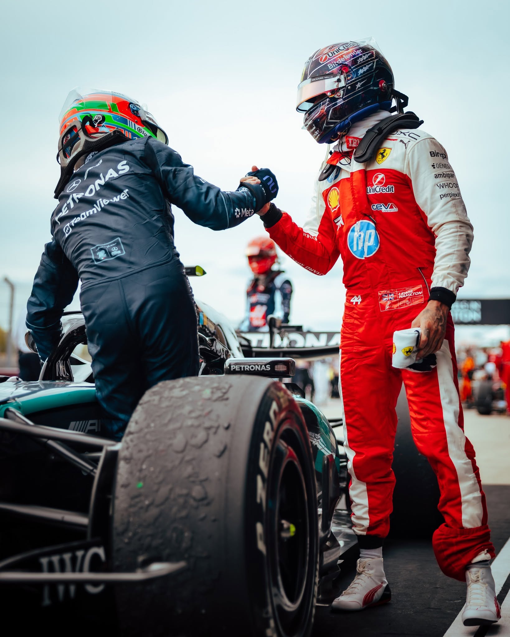 Kimi Antonelli shakes hands with Charles Leclerc in parc fermé after the 2026 United States Grand Prix