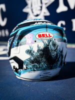 Back of Oliver Bearman's Austin 2026 helmet: Godzilla illustration in blue and black, Bell Helmets logo