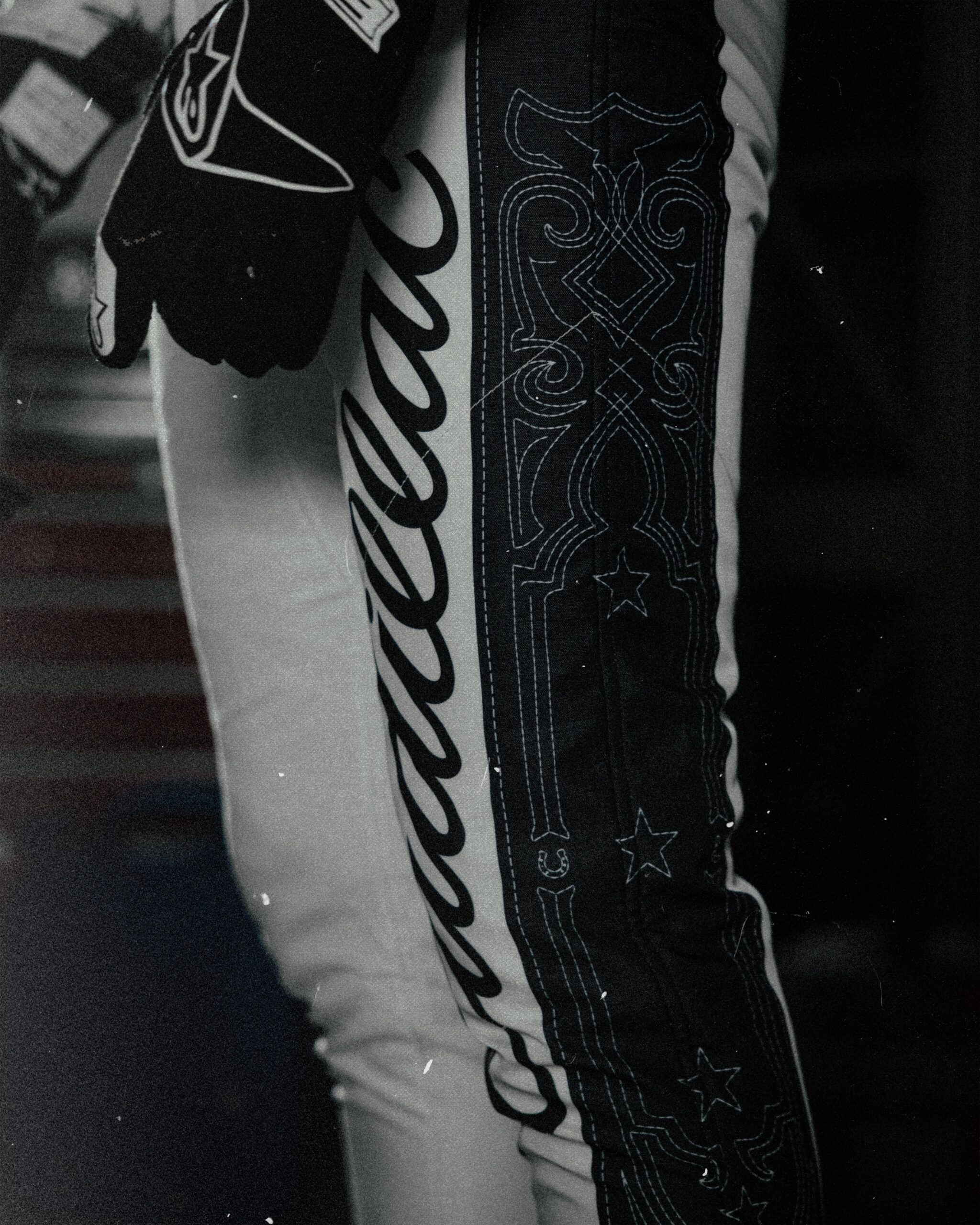 Cadillac script and western stitching down the leg of the Austin race suit
