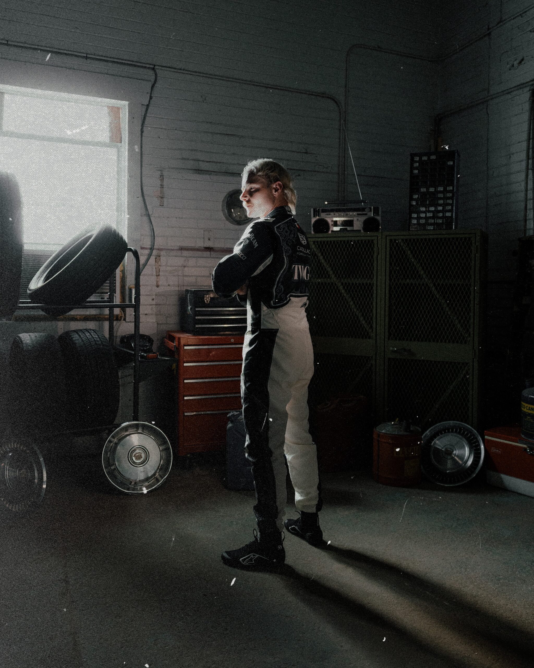 Valtteri Bottas standing in Cadillac's black and white Austin race suit