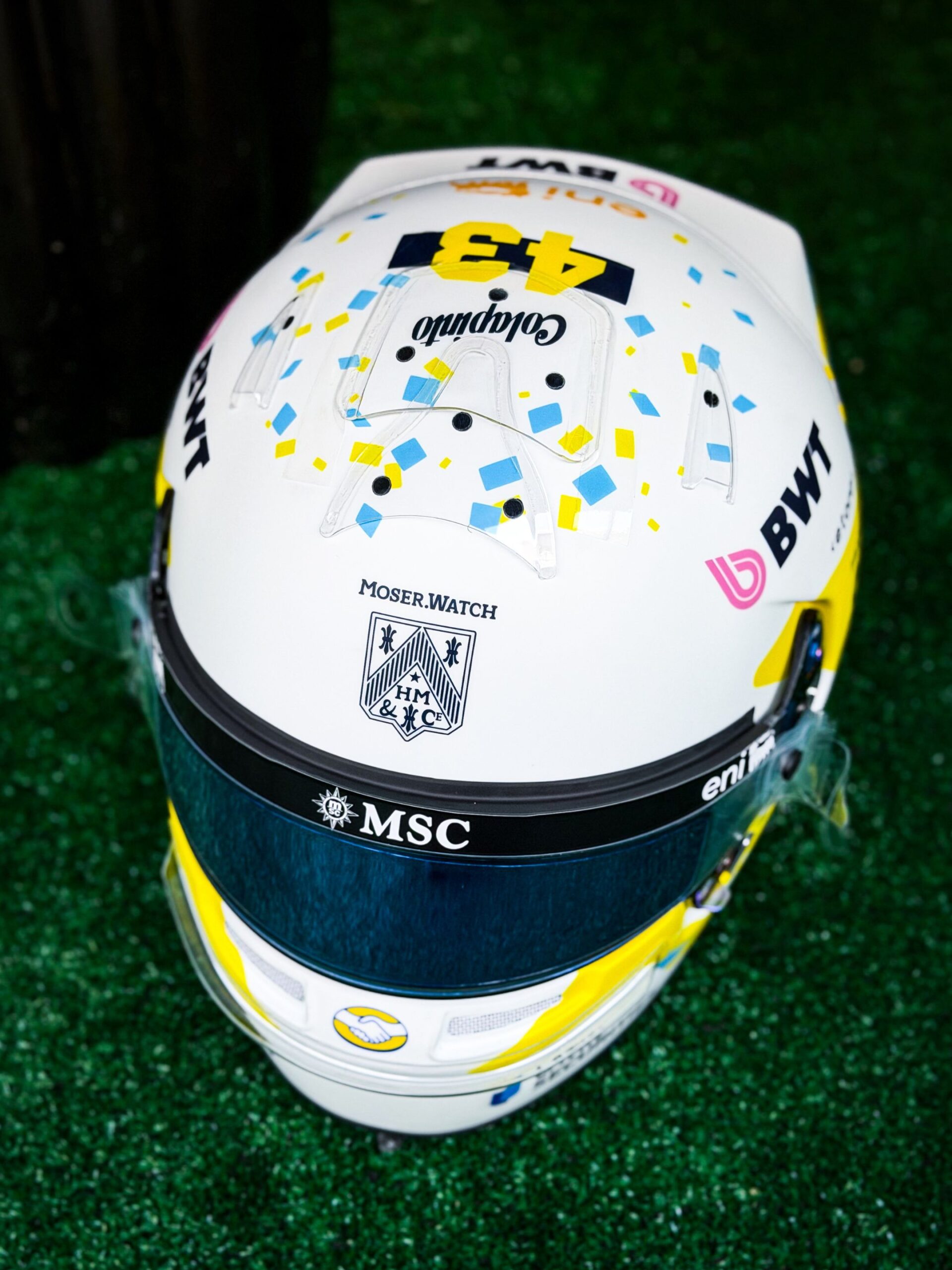 Front of Colapinto's finished Austin 2026 helmet: Moser.Watch above an MSC visor strip and a blue mirrored visor