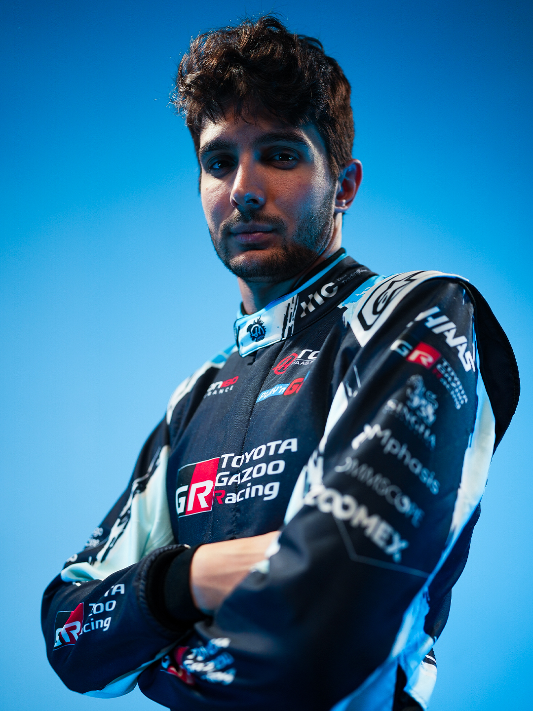 Esteban Ocon in the navy and light blue Haas Godzilla Minus Zero race suit
