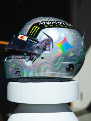 Side view of Lando Norris's 2026 US GP helmet with the rainbow Gemini star and liquid blob swirls