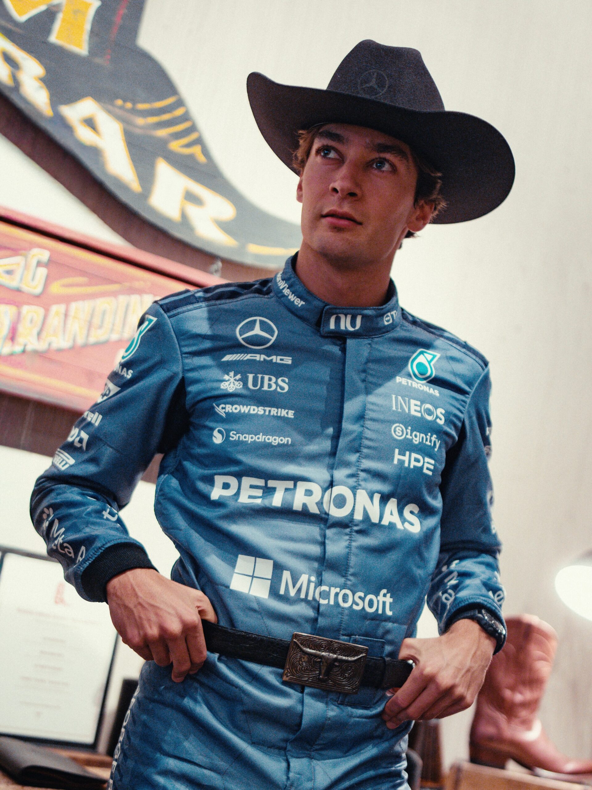 George Russell in his light blue Mercedes race suit and cowboy hat in Austin