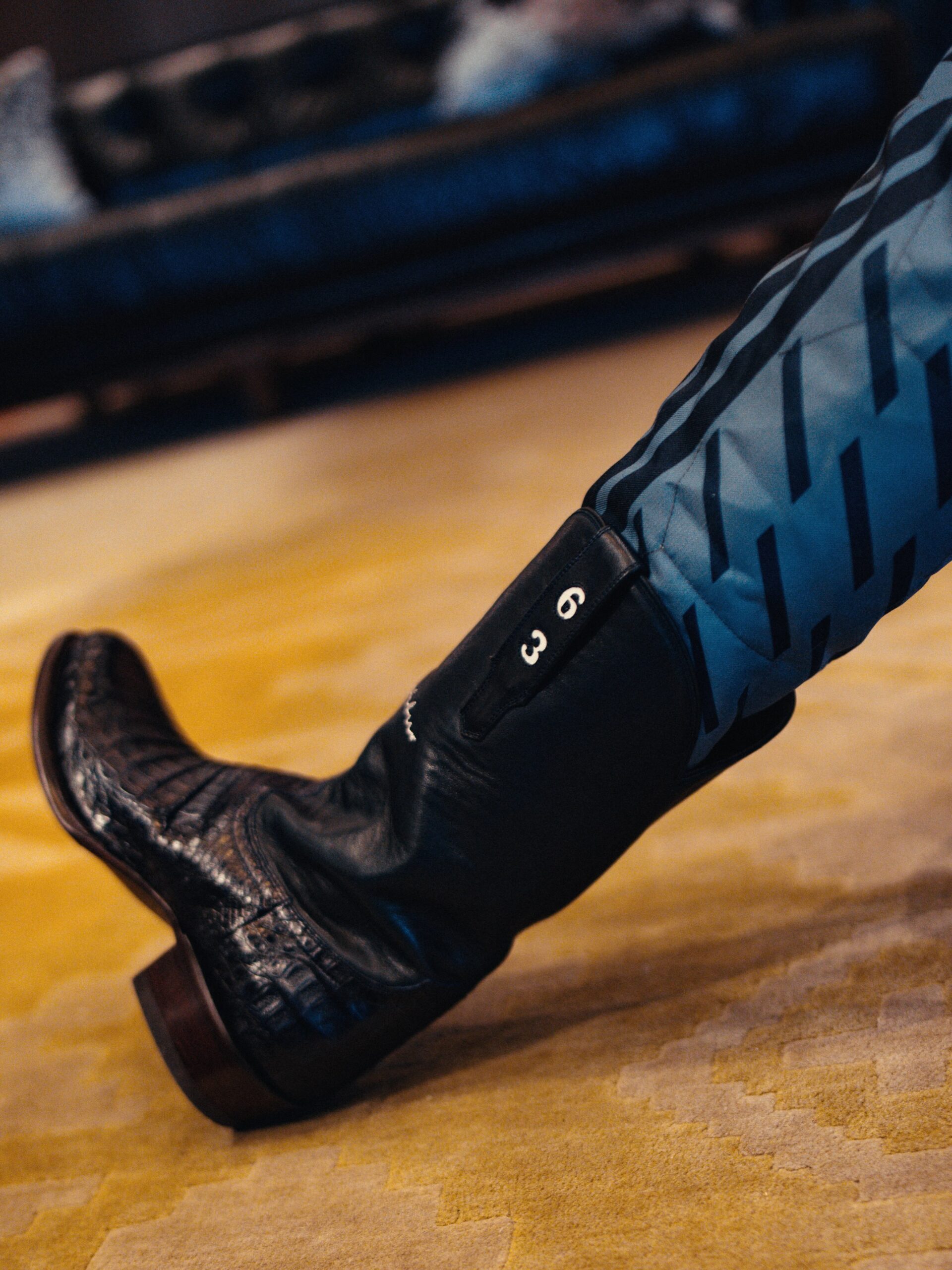 Number 63 on George Russell's western boot, below the light blue Austin race suit
