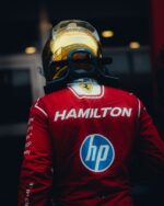 Lewis Hamilton seen from behind wearing his gold chrome 2026 Singapore GP helmet: HAM, Peroni 0.0 and the Bell logo