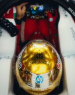 Top of Lewis Hamilton's gold chrome 2026 Singapore GP helmet in the cockpit: Perplexity, HP, UniCredit and BingX