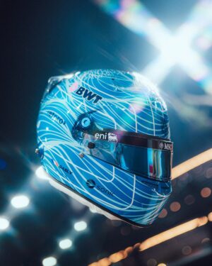 Three-quarter front view of Pierre Gasly's 2026 Singapore GP helmet: two-tone blue with white lines, BWT, eni visor strip